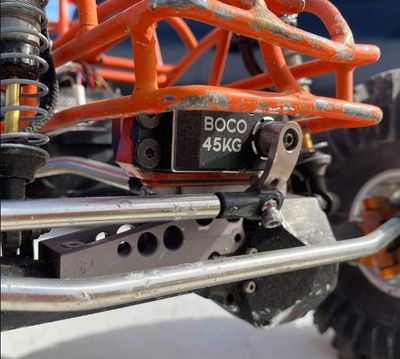 Close-up of a BOCO 45KG servo in a vehicle chassis.