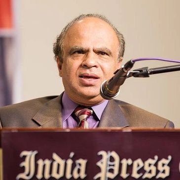A man speaking at an India Press event.