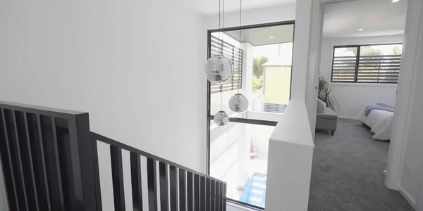 Large feature floor to ceiling window in the stairwell of a newly built home