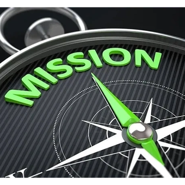 Close-up of a compass pointing to the word 'MISSION'.