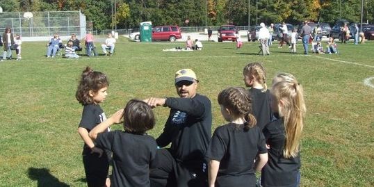 Principal, Stefan J. Jackson, coaching local Recreation Department soccer.