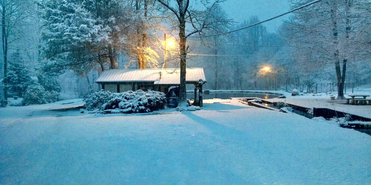 Snow covered rv site at Hickorynut Cove RV Resort