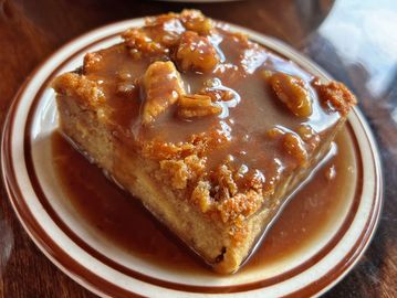 House made bread spudding with caramel sauce drizzled all over.