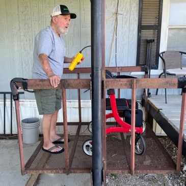 Electric wench operated wheelchair lift.