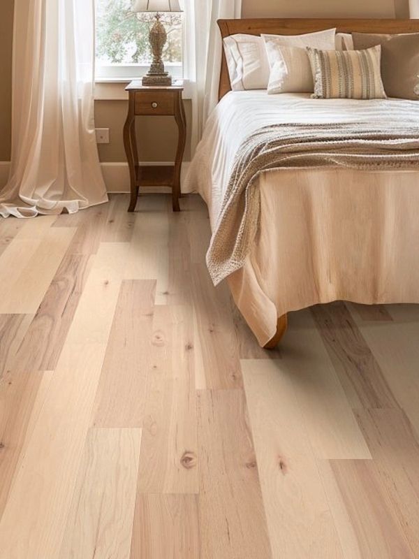A bedroom with Americana Hickory Intrinsic floors by Shaw 