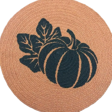 Round woven mat with pumpkin and leaves design.