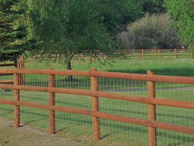 cedar fence, yard fence, stained fence, rail fence with top rail, rail fence with wire, dog fencing