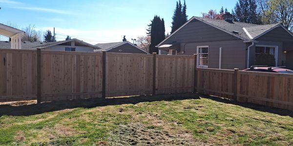 Full panel style wood fence in Puyallup, WA.