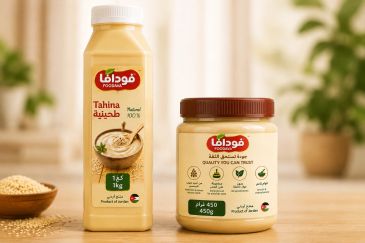 Two containers of Foodama Tahina on a table.