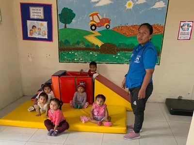 Children and teacher at Little Stars of Knowledge Learning Center, San Pedro Ecuador. Inside classro