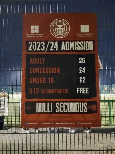 A sign with ticket prices.