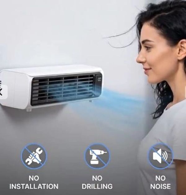 Woman enjoying cool air from a wall-mounted device.