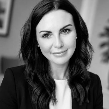 Black and white portrait of a woman with dark hair.