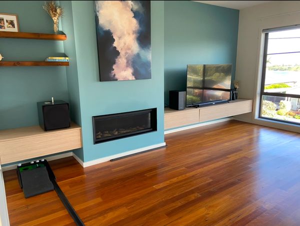 Family living room with blue feature wall. 