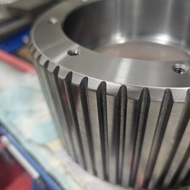 Close-up of a metal gear with grooves.