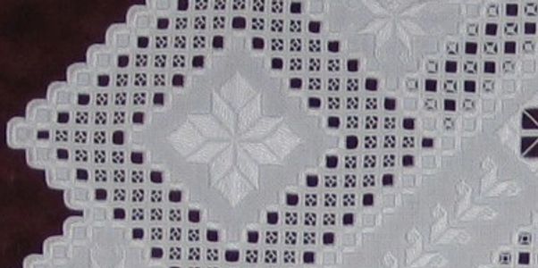 Hardanger, a type of white work embroidery, on a contemporary embroidery.  Cotton on cotton.
