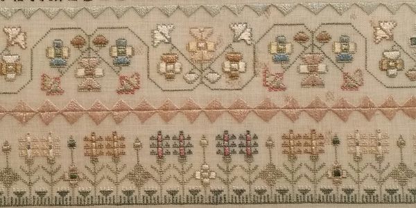 Various embroidery stitches on an early 1800s sampler.  Silk on linen.