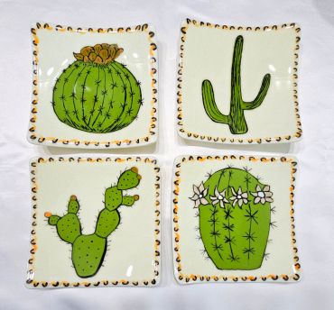 Set of four square plates with cactus designs.