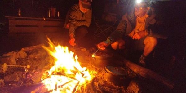 Finishing the day around a roaring campfire with campfire treats