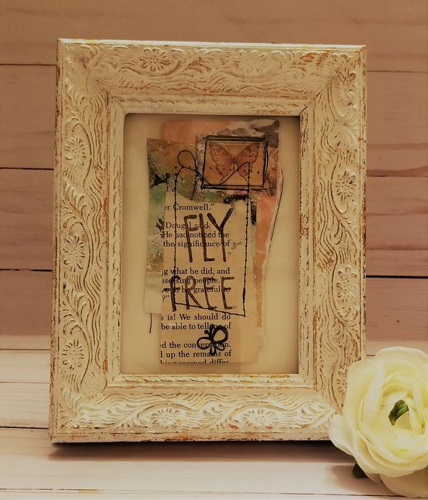 This #tinycollage features two stamped butterflies, vintage text, messy stitching and pink and green