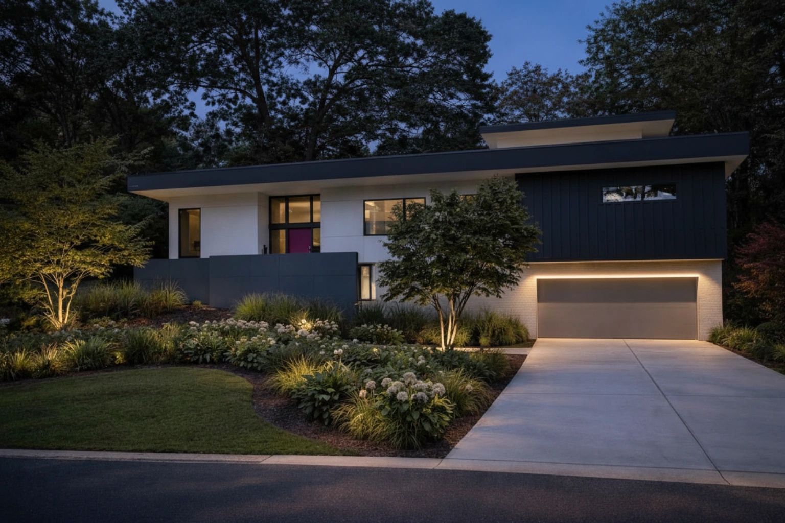 Modern house with sleek design and warm outdoor lighting at dusk.
