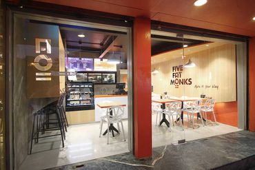 Modern dessert cafe with bright interior and stylish seating.