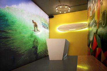Modern interior with surfing theme and vibrant wall art.