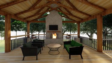Covered outdoor seating area with fireplace and TV, surrounded by trees.
