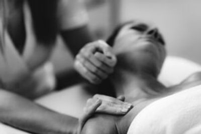 woman receives neck massage