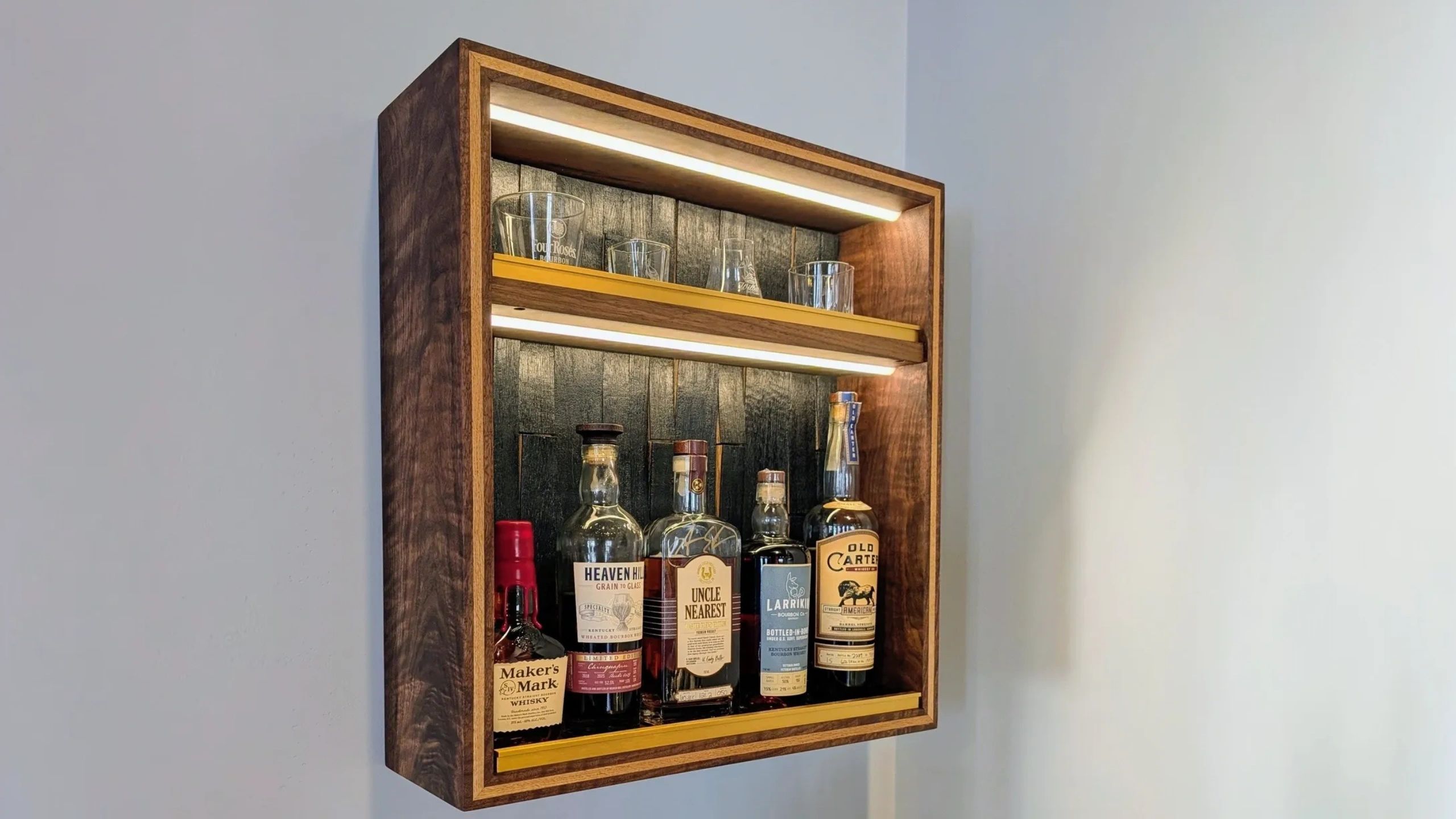 Whiskey cabinet of figured walnut. The back is from reclaimed whiskey barrel staves.
