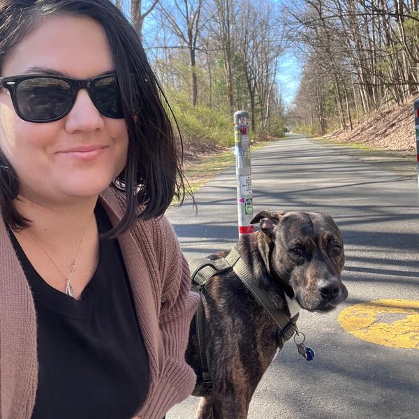 Woman with her dog on a walk.
