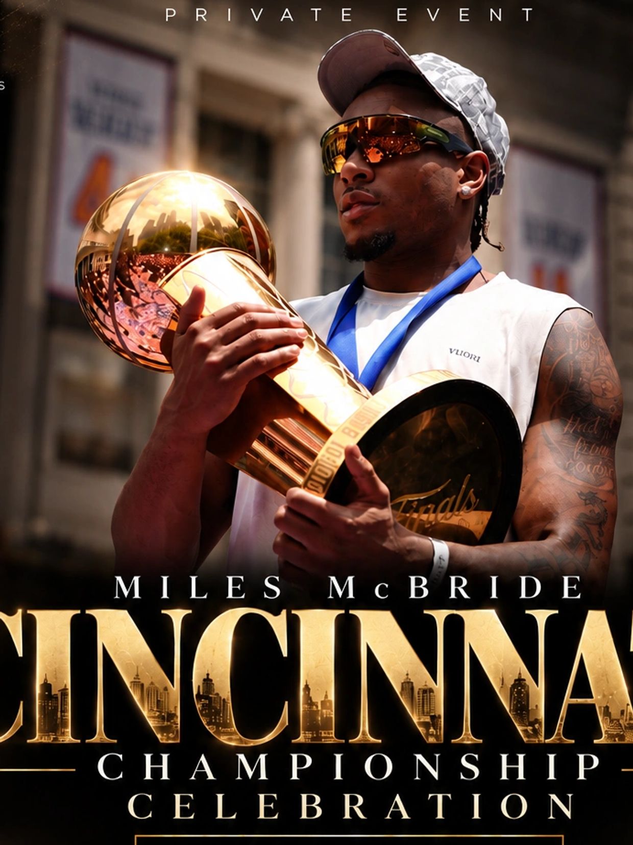 Miles McBride holds championship trophy at Cincinnati celebration event.