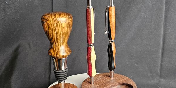 Hand turned wooden pens and bottle stoppers