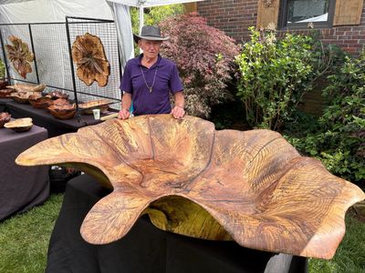 Bobby Moore standing next to his creation Worlds largest hand carved bowl
