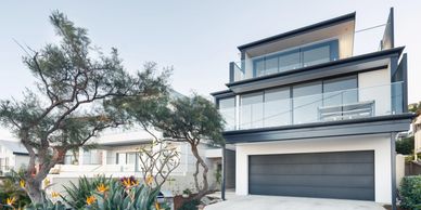 Modern front view of two story home with garage 