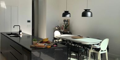 Summer Hill modern kitchen with black feature island and white cabinetry 
