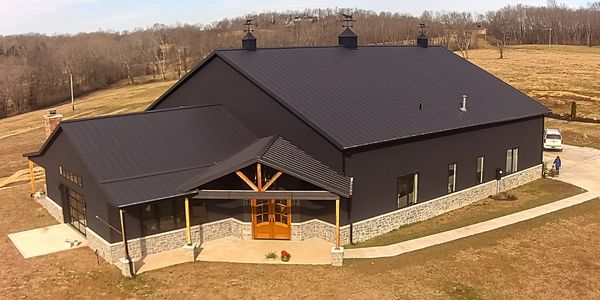 New construction, standing seam metal roofing, and board-and-batten metal siding 