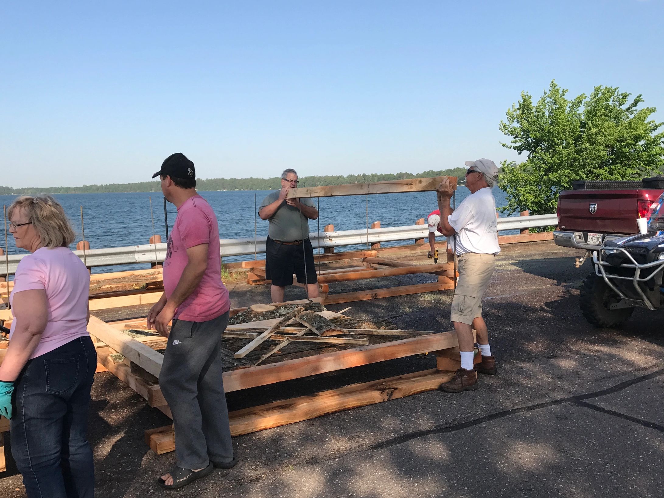 Volunteers constructing log cribs attract walleyes, bass, catfish and panfish