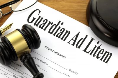 Legal document titled Guardian Ad Litem with gavel and glasses.