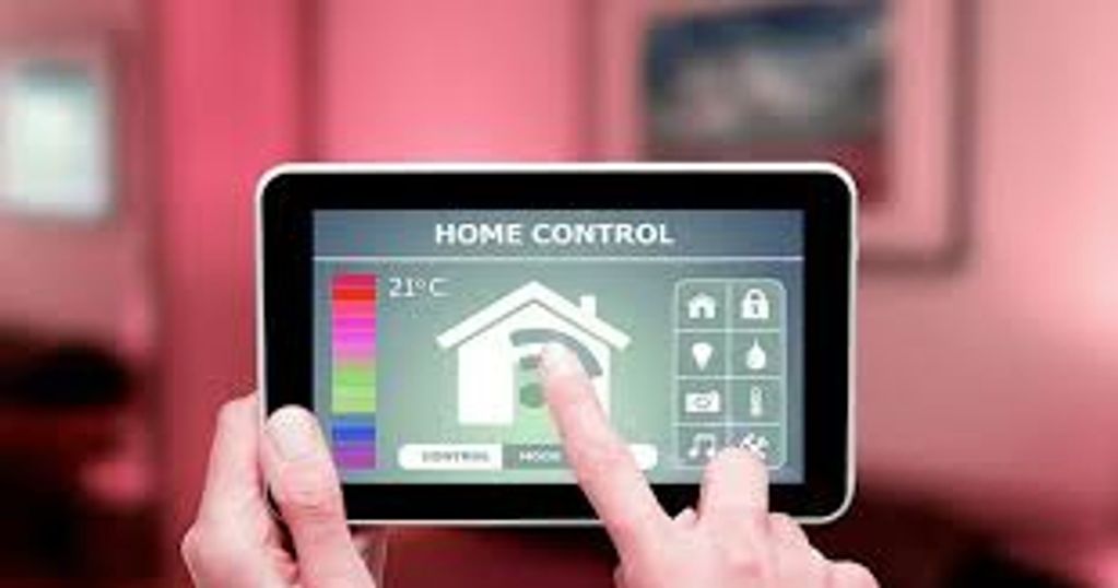 Person using a touchscreen home control panel to adjust settings.