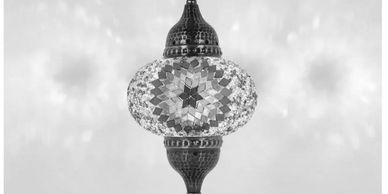 Colorful mosaic Turkish lamp glowing.