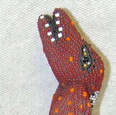 Deer Dog. Glass beads, adhesive, mortar, found object.
