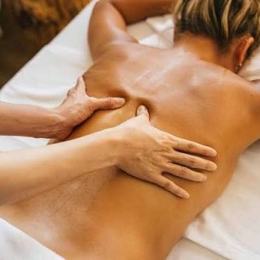 Person receiving a back massage.