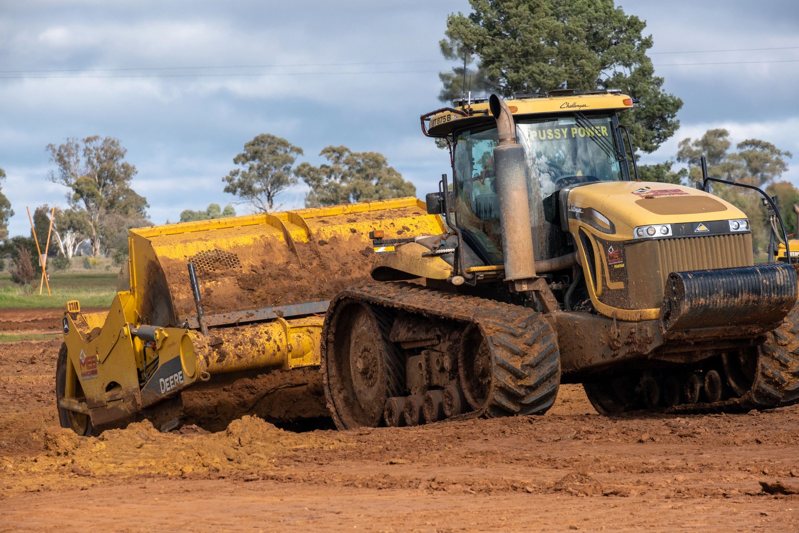 Challenger tractor with John Deere scraper