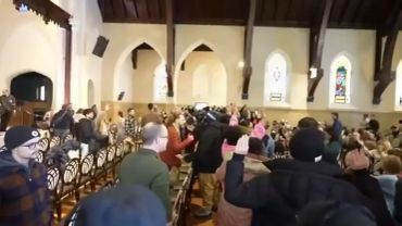 People gathered inside a church during an event.