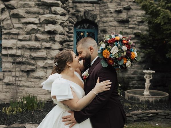 bridal wedding bouquet and groom boutonniere with wood flowers in gem tones theme