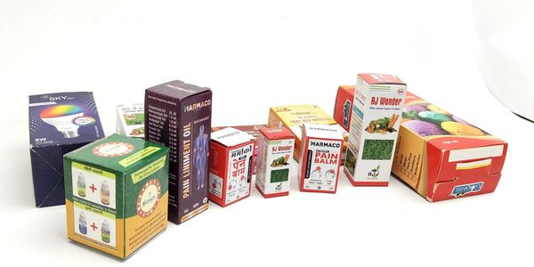 Various medicinal and herbal oil boxes arranged in a line.