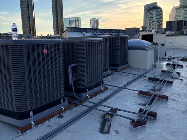 New commercial HVAC installation by Harbor Air Conditioning & Heating featuring seven indoor and out