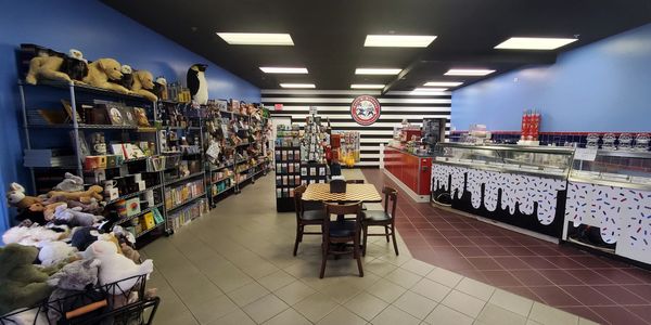 The interior of Cops & Robbers Birch Run. A gift area on the left. A ice cream counter on the right.