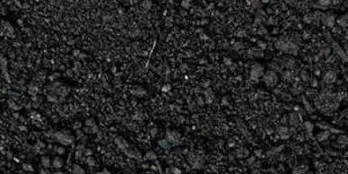 Close-up of black soil texture.